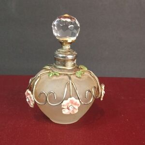 Elegant Floral Perfume Bottle with Gold Accents